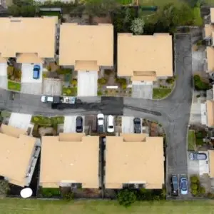 Aerial view of tan-coloured roofs at a residential complex