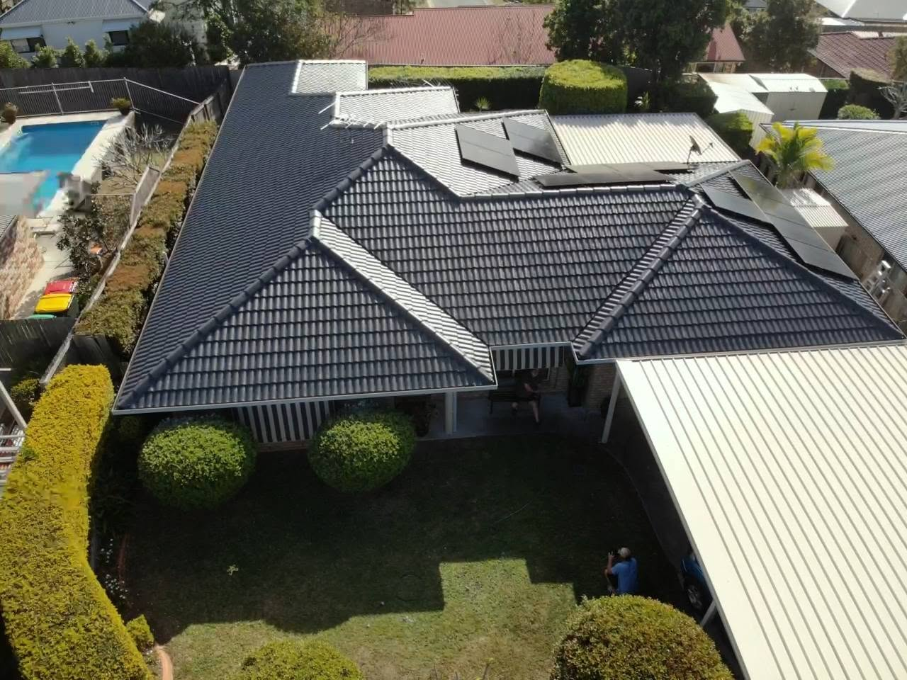 Moggill home after Charcoal roof restoration and light grey gutter and fascia repainting