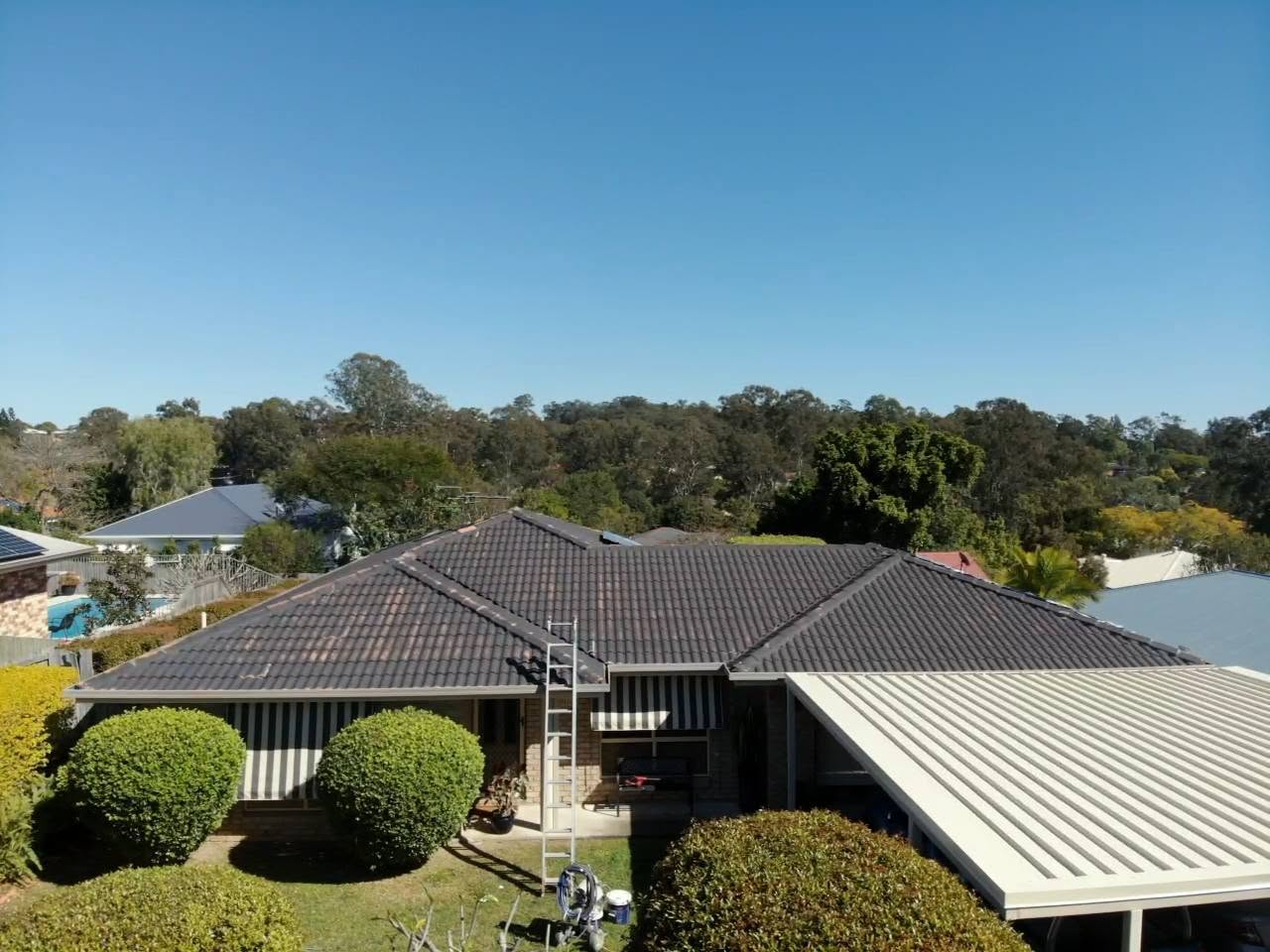Moggill home before roof restoration and gutter and fascia repainting
